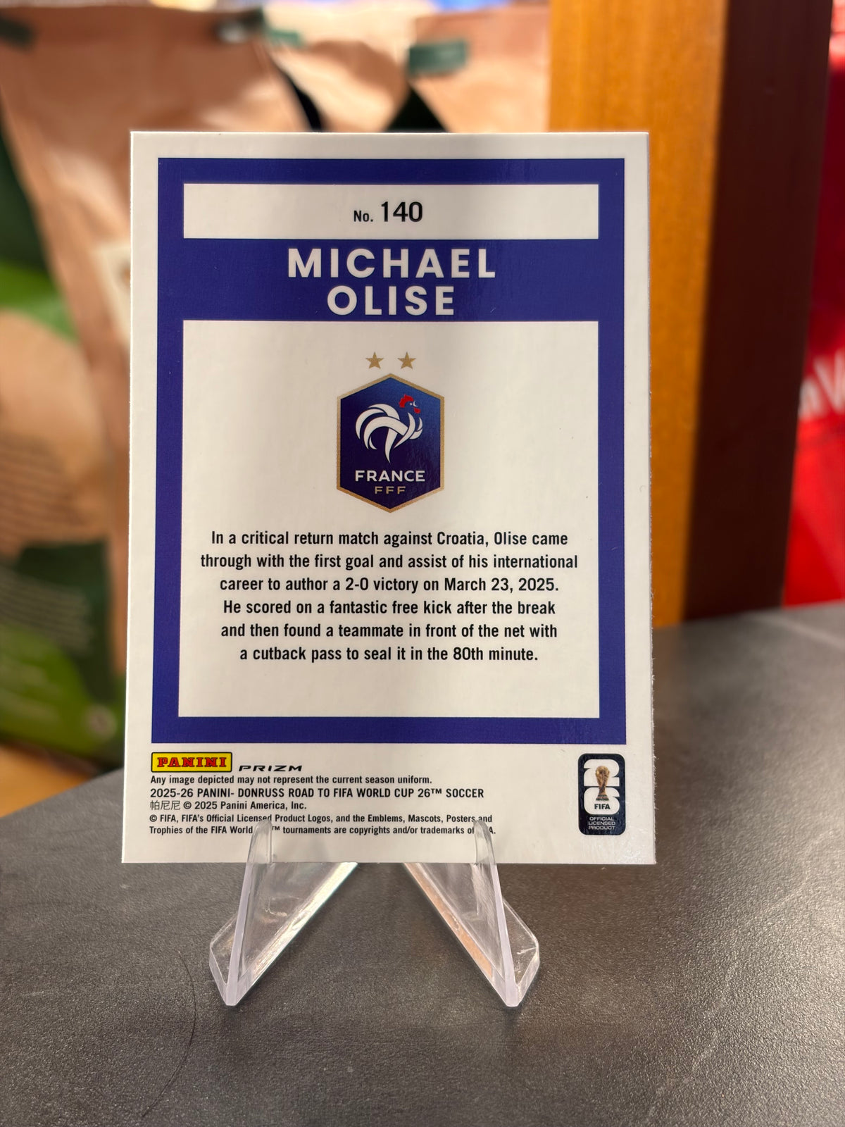 Michael Olise — Panini Donruss Optic Road to FIFA World Cup 2026 (No. 140), paralela Cracked Ice