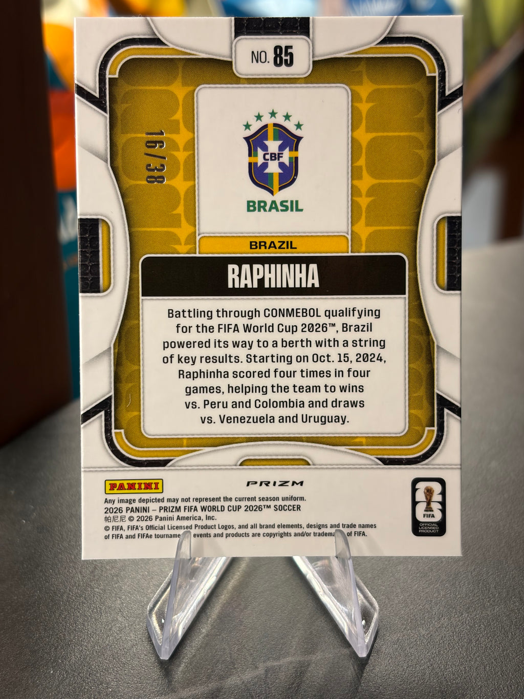 Raphinha — Panini Prizm FIFA World Cup 2026 (No. 85), paralela Choice Blue 16/38