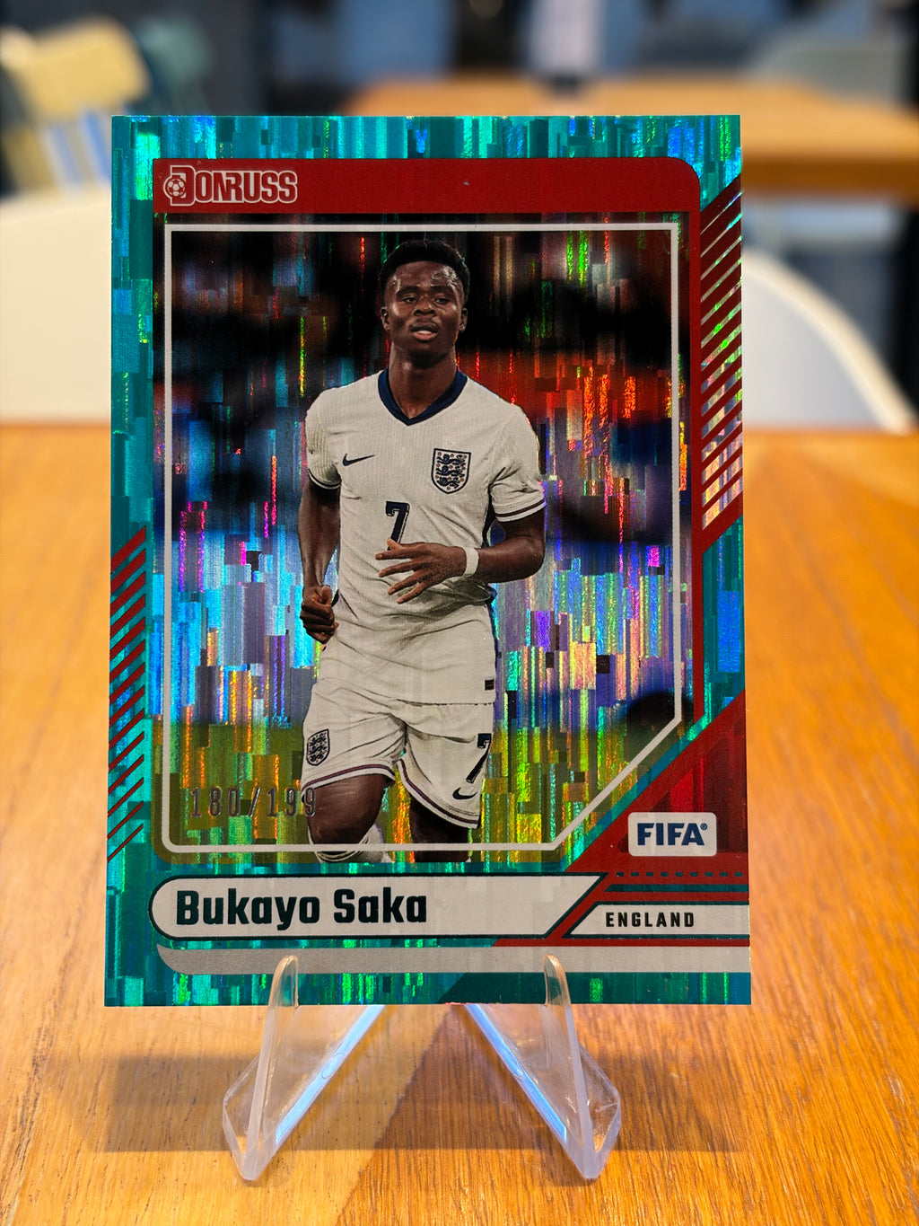 Bukayo Saka — Panini Donruss (No. 54), paralela verde azulada 180/199